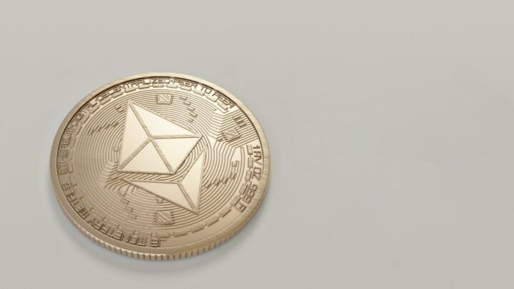 round gold colored ethereum coin