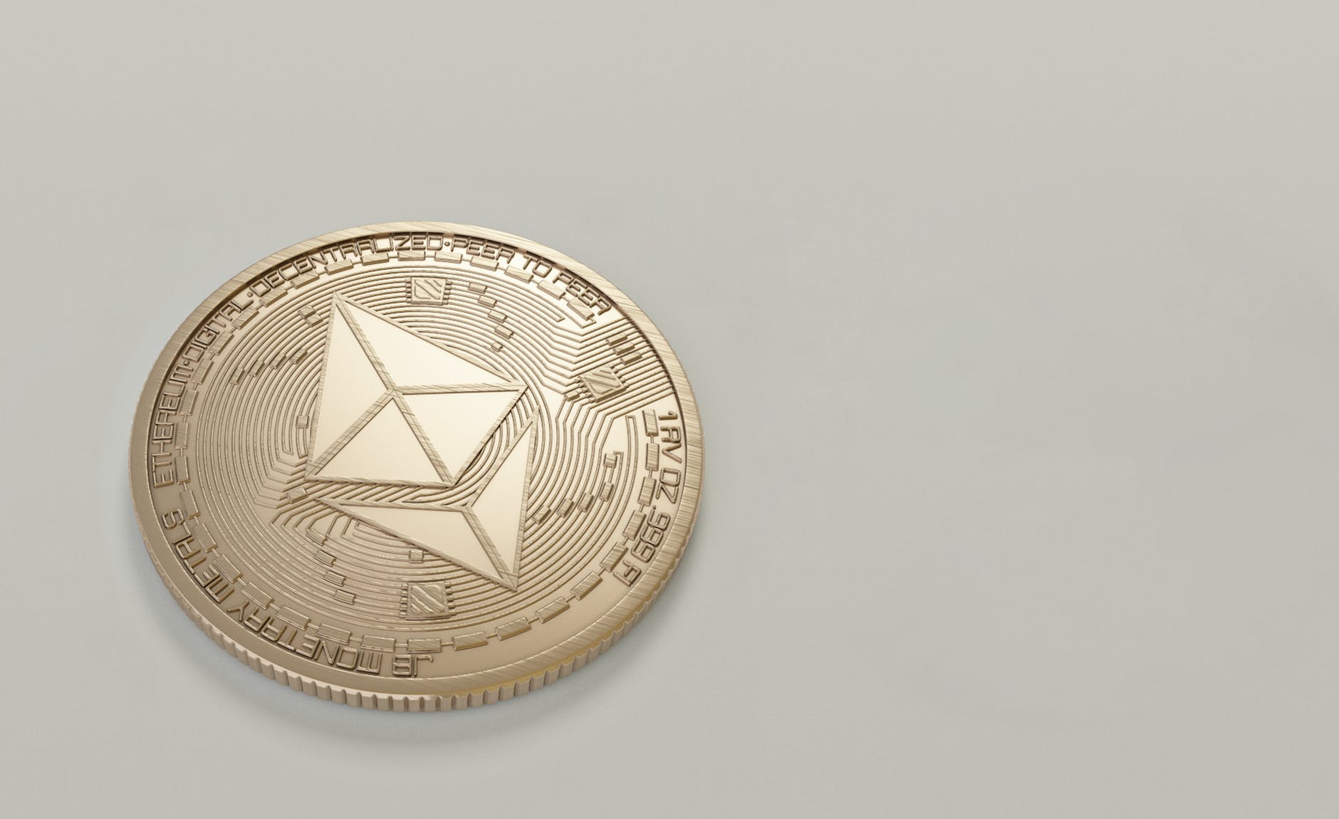 round gold colored ethereum coin